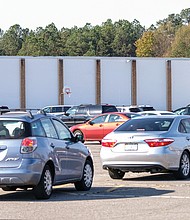 In South Side on Saturday, a long line of drivers waited at the Southside Community Center on Old Warwick Road for turkeys and other food at the 3rd Annual Turkey Give-Away sponsored by City Councilman Michael Jones.