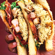 The Urban Oyster’s Hook, Line & Sinker Sandwich. Created by Norton’s father, the sandwich is comprised of fried cod, shrimp and oysters with let- tuce, tomato, bacon, and special sauce.