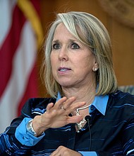 New Mexico Gov. Michelle Lujan Grisham gives her weekly update on COVID-19 in New Mexico and the state's effort to contain it during a virtual news conference from the state Capitol in Santa Fe, N.M., on July 23, 2020.
Credit: Eddie Moore/he Albuquerque Journal/AP