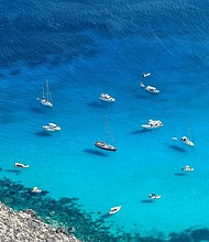 Aerial view of the "Tabaccara" beach in Lampedusa destination for tourists by boat in the crystal clear waters of the Sicilian island on August 04, 2020 in Lampedusa, Italy.
Credit:	Fabrizio Villa/Getty Images