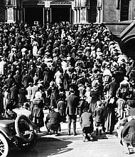The congregation of the Cathedral of Saint Mary of the Assumption praying on the steps, where they gathered to hear mass and pray during the influenza pandemic of 1918.
Credit:	Hulton Archive/Getty Images