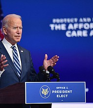 President-elect Joe Biden delivers remarks at The Queen in Wilmington, Delaware, on November 10, 2020. He has unveiled his health team that will lead the pandemic response.
Credit:	Angela Weiss/AFP/Getty Images