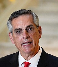 Georgia Secretary of State Brad Raffensperger speaks during a news conference on November 30, 2020, in Atlanta.
Credit:	Brynn Anderson/AP