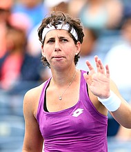 Carla Suarez Navarro of Spain waves to the crowd after defeating Venus Williams of the United States following a first round match on Day 4 of the Rogers Cup at Aviva Centre on August 06, 2019 in Toronto, Canada.
Credit:	Vaughn Ridley/Getty Images