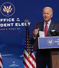 President-elect Joe Biden speaks on November job numbers in Wilmington, Delaware, on Friday, Dec. 4, 2020. (Alex Wong/Getty Images/TNS)