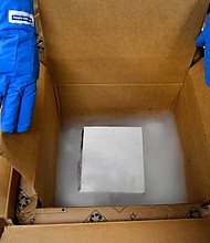 Vail Health Hospital pharmacy technician Rob Brown gets ready to take mock Covid-19 vaccines out of a thermal shipping container.
Credit:	Helen H. Richardson/Denver Post/Getty Images