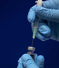 People with a "significant history of allergic reactions" should not be given the Pfizer/BioNTech coronavirus vaccine, the UK's National Health Service (NHS) advised after two healthcare workers had symptoms after receiving a shot.
Credit:	Victoria Jones/Pool/Getty Images