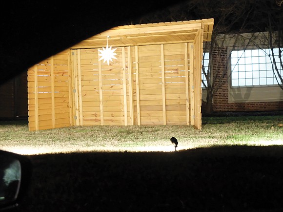 At the Nativity display outside Faith Church of Lafayette, Ind., the baby will be laid in a manger this year, ...