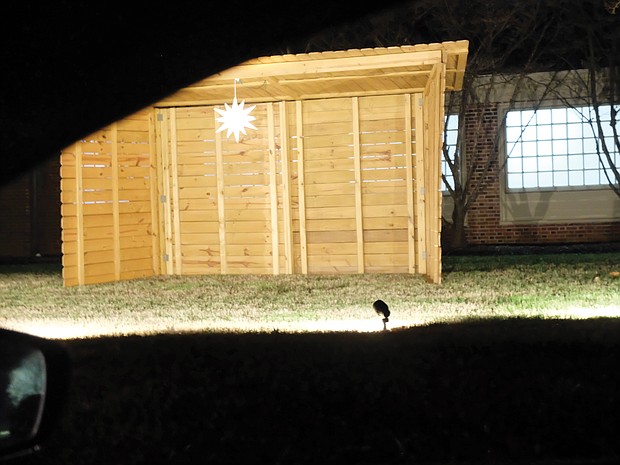 A manger is the backdrop for this Nativity scene set up in front of a church on Dumbarton Road in Henrico County.