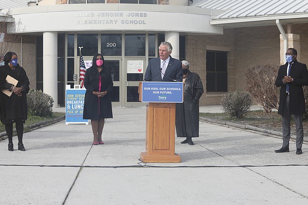 Former Gov. Terry McAuliffe, center, vows to raise teacher pay as he launches his campaign Wednesday outside Miles Jones Elementary School in South Side. Joining him are, from left, Richmond educator Dr. Milondra b. Coleman, Virginia House Majority Leader Charniele L. Herring of Alexandria, state Senate President Pro Tempore L. Louise Lucas of Portsmouth and Mayor Levar M. Stoney.