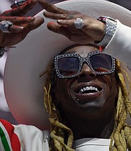 Rapper Lil Wayne faces up to 10 years in federal prison after he pleaded guilty Friday to illegal gun possession, prosecutors said.
Credit:	ANGELA WEISS/AFP/Getty Images