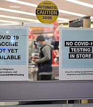 A sign on the entrance to a pharmacy reads "Covid-19 Vaccine Not Yet Available", Nov. 23 in Burbank, CA.
Credit:	Robyn Beck/AFP/Getty Images