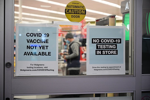 A sign on the entrance to a pharmacy reads "Covid-19 Vaccine Not Yet Available", Nov. 23 in Burbank, CA.
Credit:	Robyn Beck/AFP/Getty Images