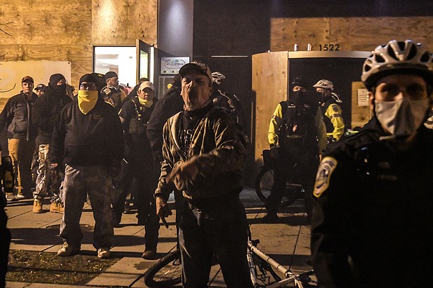 Members of the Proud Boys yell in front of a hotel during a protest on Dec. 12, in Washington, DC.
Credit:	Stephanie Keith/Getty Images