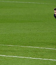 Messi looks on during Barcelona's draw with Valencia on Saturday.
Credit: LLUIS GENE/AFP/AFP via Getty Images