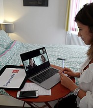 Manon, employee of global PR group Sagarmatha - Hopscotch, connects with her colleagues in Paris via videochat at her home office (teletravail) in the French riviera city of Nice, southern France, on May 15, 2020, a few days after France eased lockdown measures taken to curb the spread of the COVID-19 pandemic, caused by the novel coronavirus.
Credit: Valery Hache/AFP/Getty Images