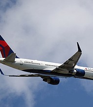 Two passengers exited a Delta flight as it was taxiing at La Guardia Airport Monday.
Credit: Bruce Bennett/Getty Images