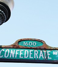 Two signs depict the old and the new when it comes to the name of this North Side street whose residents include U.S. Sen. Tim Kaine and his wife, Anne B. Holton. The aging street sign still reads Con- federate Avenue, while the sign in the next picture, in the median, displays the new name City Council officially approved last month for the street — Laburnum Park Boulevard. The city Department of Public Works has not announced when the replacement signs bearing the new name will be put in place.