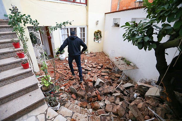 A man walks over debris in Zagreb, the Croatian capital.
Credit: Antonio Bronic/Reuters