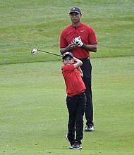 Tiger Woods and his 11-year-old son, Charlie, play PNC Championships in Orlando.