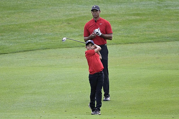 Tiger Woods and his 11-year-old son, Charlie, play PNC Championships in Orlando.