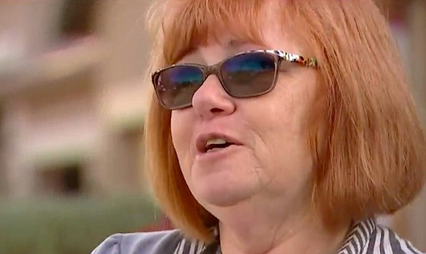 Carolyn Palisch is being called a hero after she rescued her neighbors when their house caught fire
Credit:	KPHO/KTVK