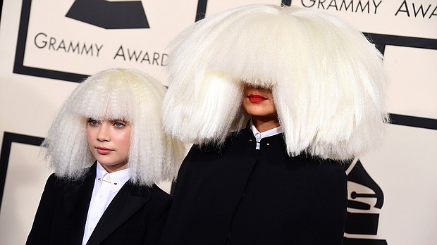 Maddie Ziegler, left, and Sia pictured on February 8, 2015 at the 2015 Grammy Awards in Los Angeles. Sia defended her decision to cast Ziegler in her upcoming movie, 'Music.'
Credit:	Jordan Strauss/Invision/AP
