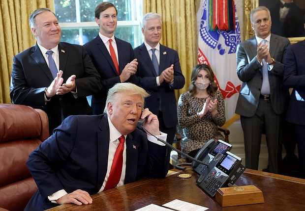 This image shows President Donald Trump speaking with Israeli Prime Minister Benjamin Netanyau on the phone in the Oval Office on October 23, 2020, in Washington, DC. There were 18 attempted calls from the White House to the Georgia secretary of state's office between the election and the phone call on January 2, 2021, a source with knowledge and a Georgia state official confirmed to CNN.
Credit:	Win McNamee/Getty Images North America/Getty Images