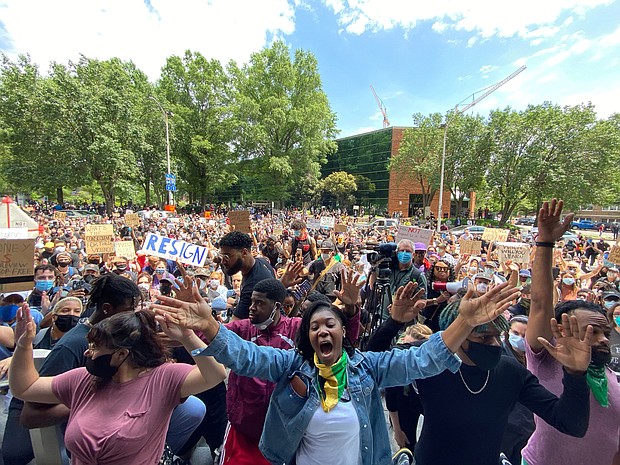 An angry and frustrated crowd of about 1,500 people descend on City Hall, below right, calling for the resignation of Richmond Police Chief Will Smith and Mayor Levar M. Stoney, despite their apologies for the police action. Chief Smith resigned on June 16.