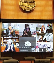 Richmond City Council members applaud during the swearing-in ceremony Monday at City Hall. They were sworn in one member at a time in person in the City Council Chambers and then met virtually as a group from their City Hall offices.