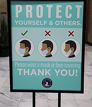 City Hall is being proactive in pushing safe practices during the pandemic. This sign was prominently displayed outside the second floor City Council Chambers on Monday before the nine council members were sworn in — including seven women, the most ever. Only a few people, mostly media and some family members, were allowed in the chamber for the ceremony. Others were able to connect to online channels to see the public ceremony.