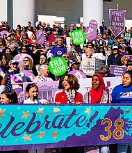 Hundreds of women and their supporters, including First Lady Pam Northam, center, celebrate Virginia becoming the 38th state to ratify the Equal Rights Amendment. The celebration included a rally, speakers and a march from Monroe Park to the Capitol on March 8, International Women’s Day.