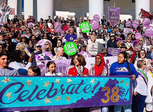 Hundreds of women and their supporters, including First Lady Pam Northam, center, celebrate Virginia becoming the 38th state to ratify the Equal Rights Amendment. The celebration included a rally, speakers and a march from Monroe Park to the Capitol on March 8, International Women’s Day.