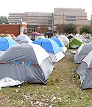 Dozens of tents house the homeless at “Cathy’s Camp,” a tent city that sprang up adjacent to the city’s winter overflow shelter and across the street from the Richmond Justice Center on Oliver Hill Way. The city razed the encampment in late March, moving people to area hotels during the COVID-19 crisis.