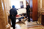 U.S. Capitol Police hold protesters at gunpoint near the House Chamber inside the Capitol. The Trump mob broke windows and forced their way into the building, which went on lockdown.
