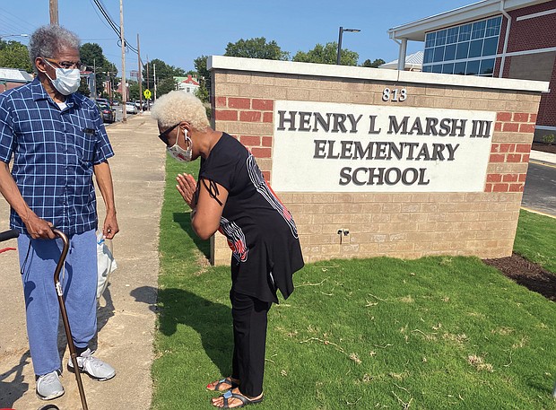 Henry L. Marsh III, a former state senator and Richmond’s first African- American mayor, is greeted on Aug. 27 by School Board member Cheryl L. Burke as he gets his first look at the new $40 million elementary school named for him in Church Hill, located at 813 N. 28th St. The school, which replaces the former George Mason Elementary that Mr. Marsh attended as a child, is one of three new city school buildings that were ready for use but remained closed as Richmond Public Schools students continued with online classes in the fall.