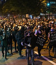 About 1,000 protesters march through Richmond to show solidarity with demonstrators in Portland, Ore., where federal officials used questionable force to detain or arrest people.