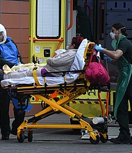 The United Kingdom is entering its most challenging weeks since the start of the Covid-19 pandemic, a top official said on Jan. 11. A patient is seen arriving at the hospital on Jan. 8 in London, England.
Credit:	Leon Neal/Getty Images