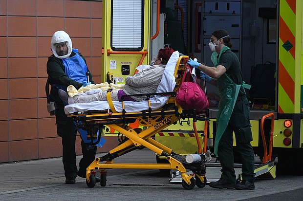 The United Kingdom is entering its most challenging weeks since the start of the Covid-19 pandemic, a top official said on Jan. 11. A patient is seen arriving at the hospital on Jan. 8 in London, England.
Credit:	Leon Neal/Getty Images