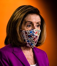 Speaker of the House Nancy Pelosi calls for the removal of President Donald Trump from office either by invocation of the 25th Amendment or Impeachment at the Capitol on Jan. 7, in Washington, DC.
Credit:	Samuel Corum/Getty Images