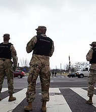 Mayor Muriel Bowser on Jan. 11 urged Americans to avoid the city during President-elect Joe Biden's inauguration. Members of the DC National Guard are seen providing traffic control on Jan. 5.
Credit:	Jacquelyn Martin/AP