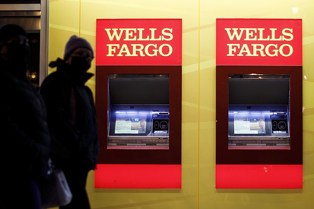 Wells Fargo can't seem to escape its troubled past. Pedestrians wearing protective masks walk past automated teller machines at a Wells Fargo bank branch at night in Washington, DC, on January 7.
Credit:	Ting Shen/Bloomberg/Getty Images
Dateline:	Washington, DC, United States