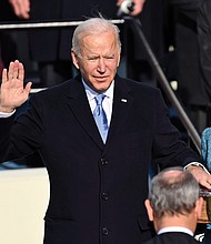Joseph R. Biden Jr. is sworn in as the 46th president of the United States by U.S. Supreme Court Chief Justice John Roberts as his wife, Jill Biden, holds a Bible that has been in the family since the 1800s.