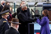 Former President Obama greets Vice President Kamala Harris with a double fist bump as she walked to her seat on the inaugural stage. The gesture was heavy with symbolism from the two history makers.