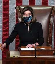 Speaker of the House Nancy Pelosi puts down the gravel as she presides the US House of Representatives vote on the impeachment of US President Donald Trump at the US Capitol, January 13, in Washington, DC.
Credit:	SAUL LOEB/AFP/Getty Images
