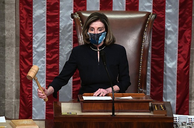 Speaker of the House Nancy Pelosi puts down the gravel as she presides the US House of Representatives vote on the impeachment of US President Donald Trump at the US Capitol, January 13, in Washington, DC.
Credit:	SAUL LOEB/AFP/Getty Images