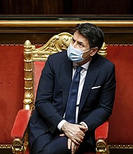 Italian Prime Minister Giuseppe Conte will resign on Tuesday morning, his office said in a statement on Monday, heightening political turmoil in the country as it battles Covid-19.
Credit:	YARA NARDI/AFP/POOL/AFP via Getty Images