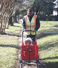 Recent days with warm sunshine made it perfect for an outdoor stroll for Harris Wheeler, aka “PaPa,” and his granddaughter Nia Rose Henderson, 2. The pair were enjoying a walk on DuBois Avenue in North Side.