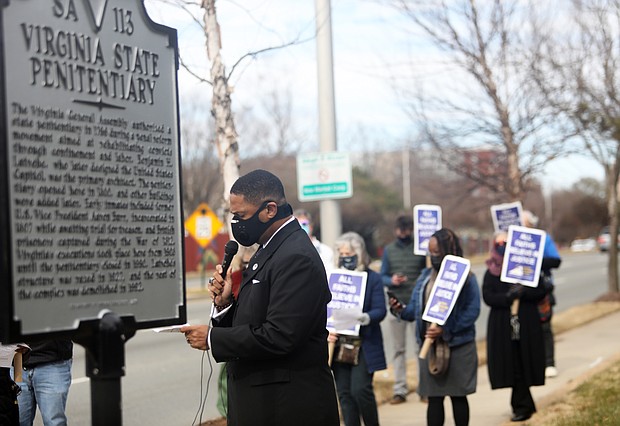 The Rev. Duane Hardy, pastor of Seven Pines Baptist Church in Sandston, leads a prayer during a vigil Jan. 22 near the site of the former Virginia State Penitentiary in Richmond seeking the abolition of the death penalty in the commonwealth. It was one of several vigils held around the state last week calling for the elimination of the death penalty.