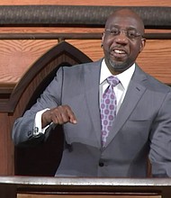 The Rev. Raphael Warnock preaches during last Sunday’s virtual service at Ebenezer Baptist Church in Atlanta. The sermon was pre-recorded in the church sanctuary.